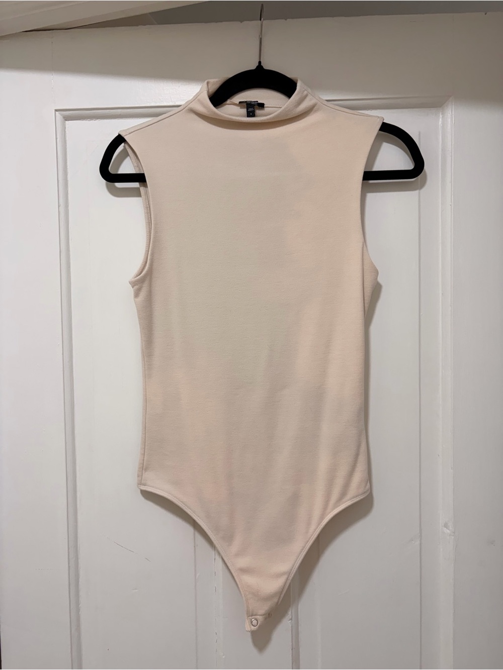 Sleeveless Mock Neck One-Piece Bodysuit in Cream